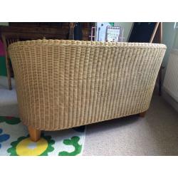 2 seater compact wicker sofa with beige cushion