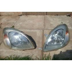 Toyota yaris front head lights both with bulbs good condition CHEAP